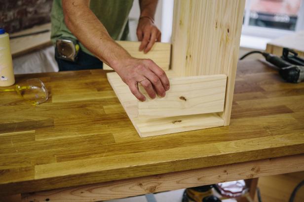 Attach tray supports to cabinet door.