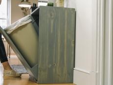 Hide the unsightly trash bin with a stylish, seamless cabinet.