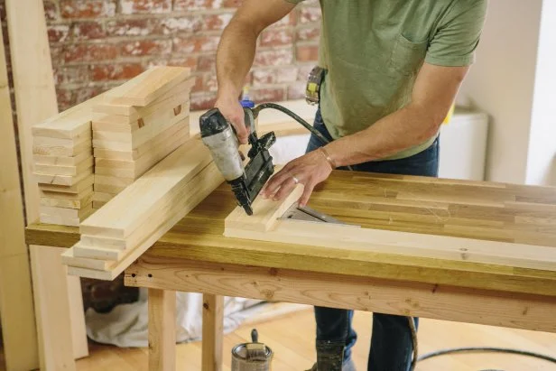 Attach first wood pieces at a 90 degree angle to make a modern bench.