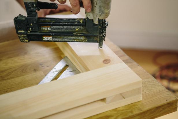 Attach first wood pieces using a nail gun.
