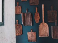 Black Wall Decorated With Vintage Serving Boards