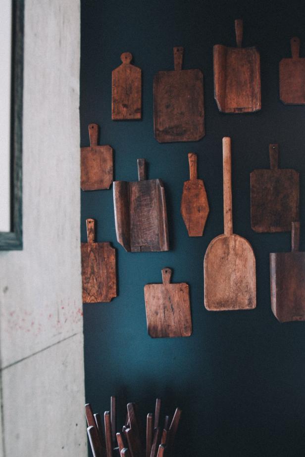 Vintage wooden cutting board on top of black stone kitchen stone