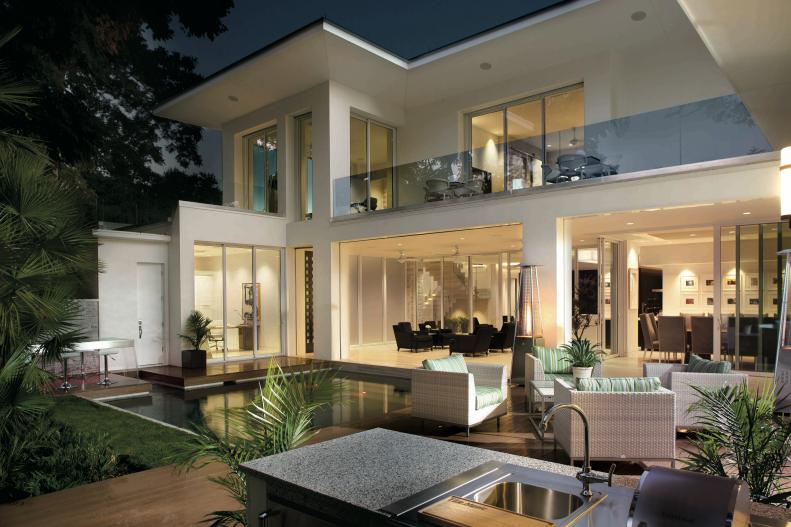 Modern White House Exterior With Pool and Outdoor Living Space