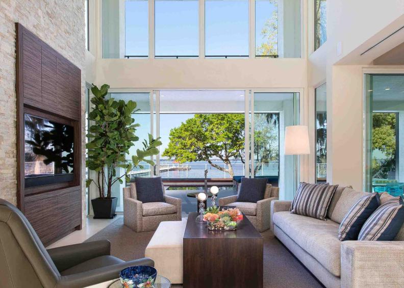 Contemporary White Living Room With Large Windows & Neutral Furniture