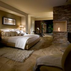 Contemporary Bedroom Features Stunning Fireplace