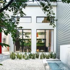 Contemporary Entry Boasts Red Door & Cool Waterfall