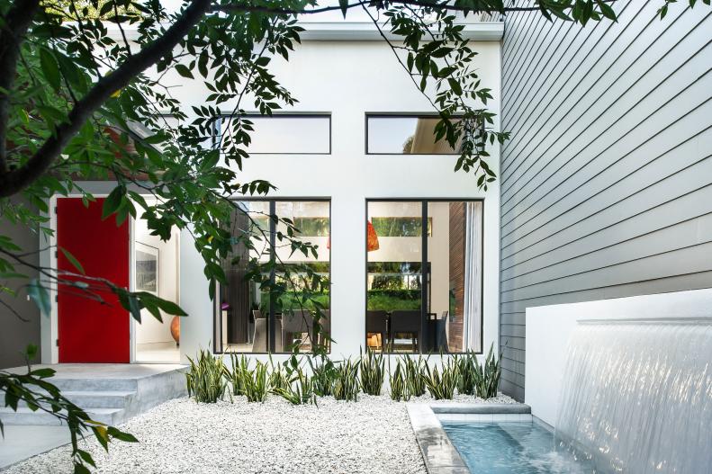Contemporary White and Gray Home Exterior With Red Front Door