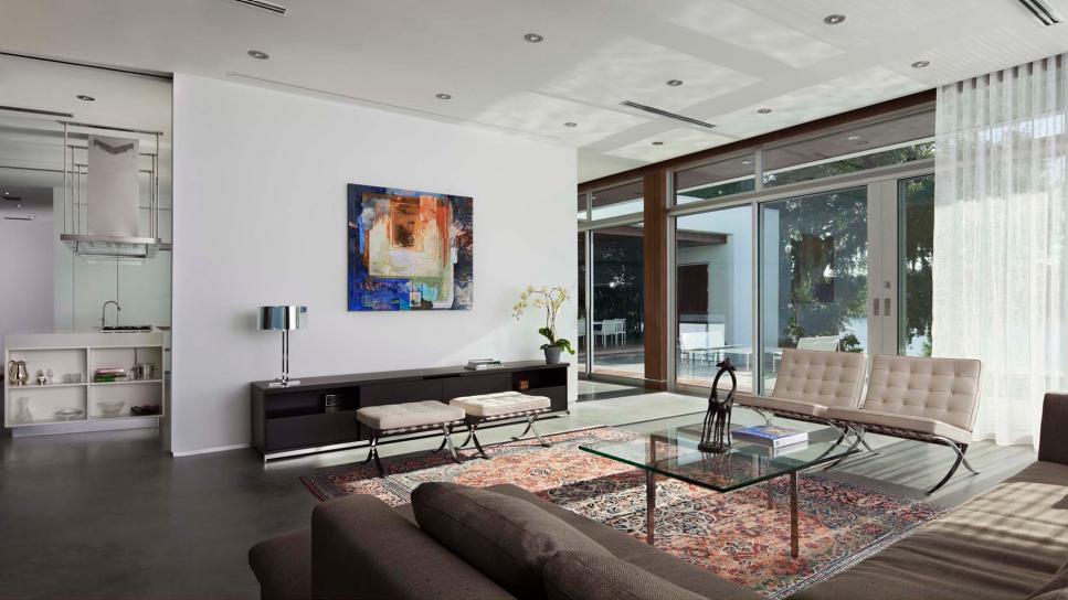 White Modern Living Room With Window Walls | HGTV
