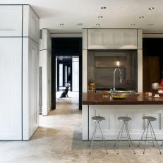 White Open Concept Kitchen With Barstools