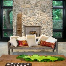 Neutral Tropical Living Room With Stone Fireplace