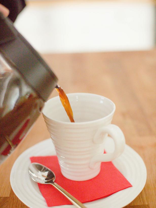 Add about ¼ tsp of maple syrup into the bottom of each cup, then top off with about a 1/2 cup of the warm spiced coffee mixture from the carafe. Spoon the foamed milk on top to fill each cup to about an inch below the rim.