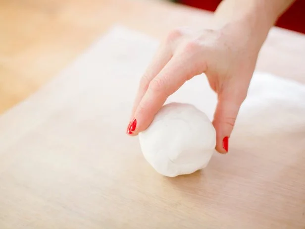 Roll the clay into a nice tight ball and place on wax paper.