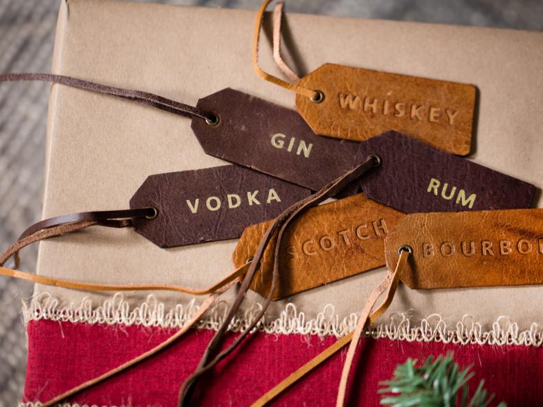 With more and more hosts serving spirits in decorative glass bottles, it can be tricky for guests to identify what's what. Embossed, leather drink IDs can make bartending easier for hosts and their guests.