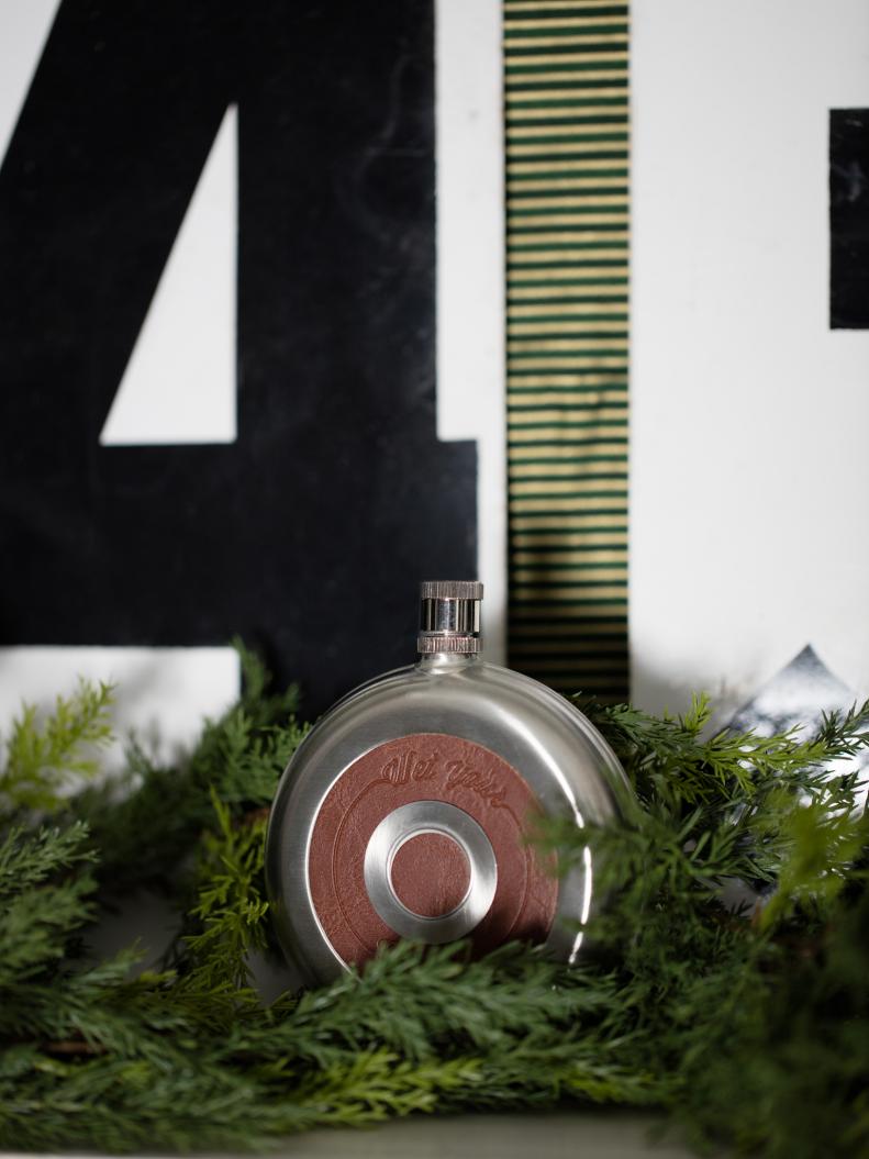 If your host has a favorite holiday spirit, make it mobile with a leather-wrapped mini flask. Small enough to stick inside of a jacket pocket, mini flasks allow guests to keep mixing their favorite drinks as they make their way around a party.