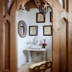 Powder Room with Custom Marble Sink and Carved Wood Door