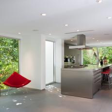 Modern Kitchen Features Large Stainless Steel Island