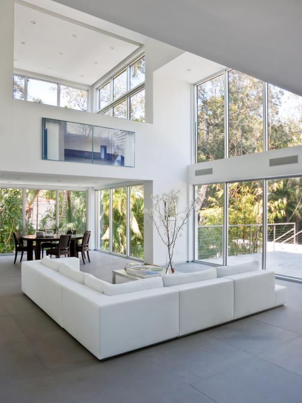 Two-Story Modern White Living Space With White Sectional