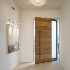 White, Modern Foyer with Distinctive Front Door