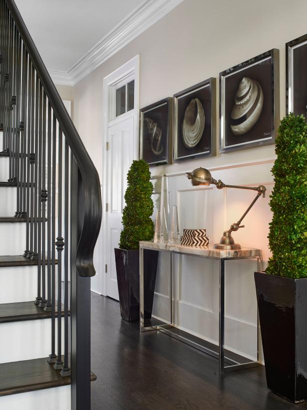 Transitional Entry Hall With Stairs and Abstract Art