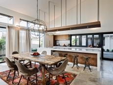 Open-Concept Kitchen and Dining Area With Rustic Table, Vault Ceiling