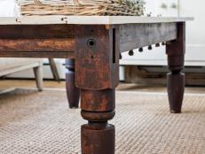 Salvaged wood and architectural remnants are prime candidates to be repurposed as furniture. In the case of this table, pieces of an old rope bed and a beadboard door are upcycled into a functional and one-of-a-kind coffee table. 
