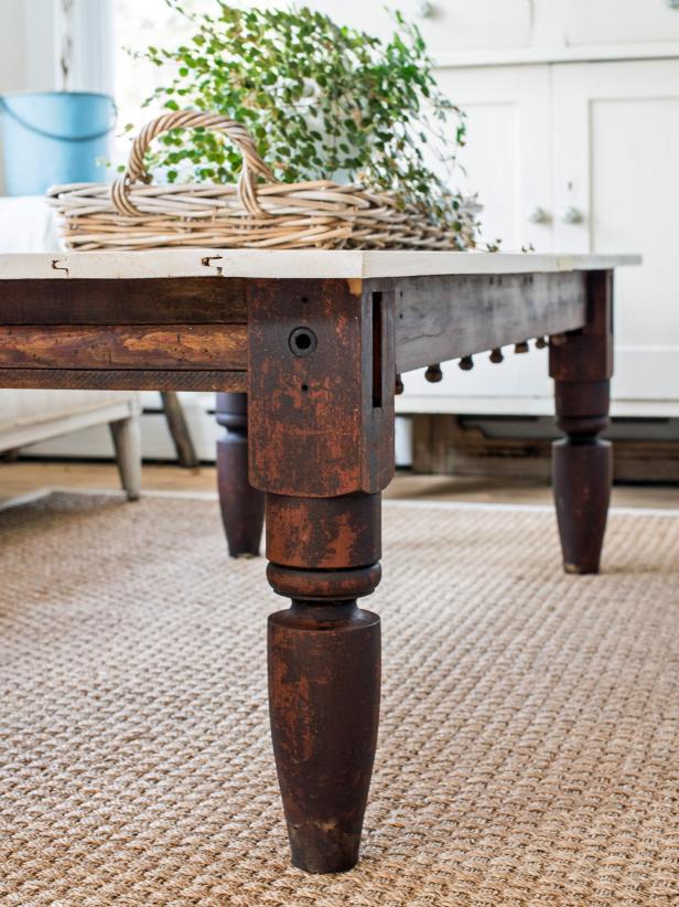 Salvaged wood and architectural pieces are prime candidates to be repurposed as furniture. In the case of this table, pieces of an old rope bed and a bead board door are converted into a functional and one-of-a-kind coffee table.