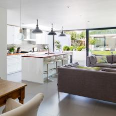 Open-Plan Kitchen and Living Space With Industrial Lights