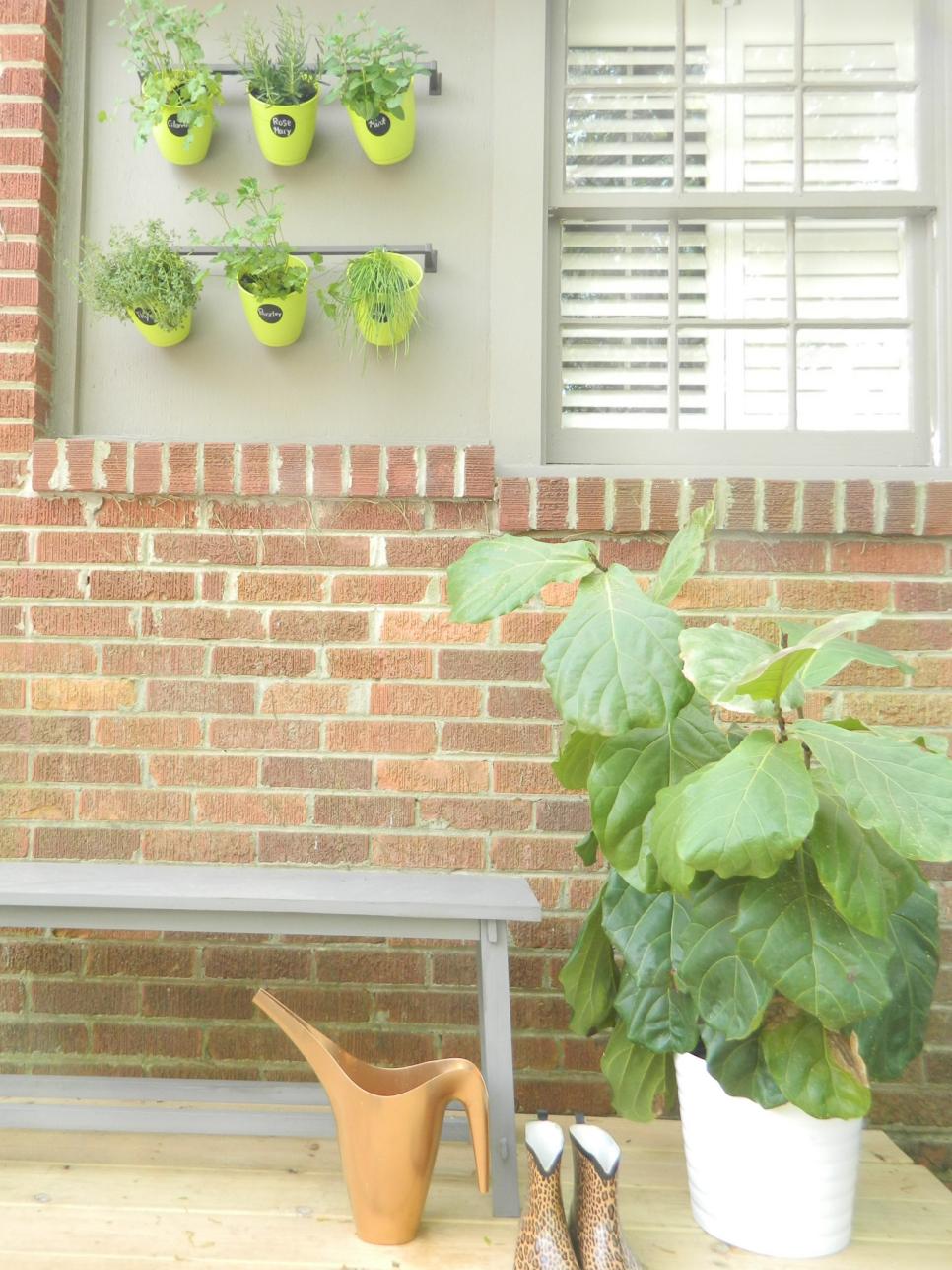 Patio with Hanging Plants and Brick Walls | HGTV
