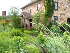 A Stone Farmhouse Framed by a Verdant Country Garden