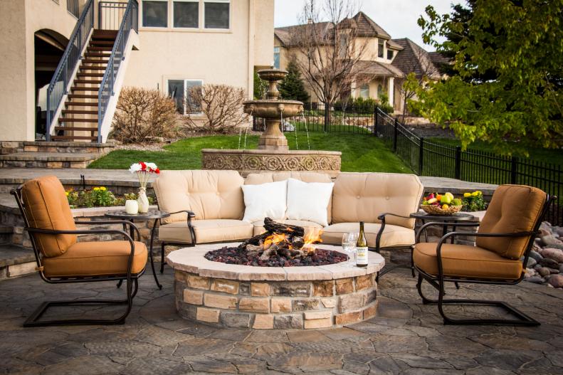 A fire pit with sofas and chairs