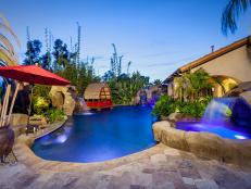 A Tropical Backyard Poolscape With Luxurious Features