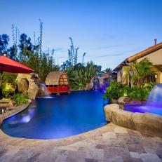 A Tropical Backyard Poolscape With Luxurious Features