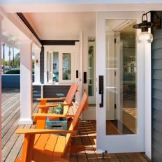 Gray and White Porch with Orange Rockers