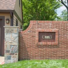 Brick Wall with Craftsman Style Ceramic Pine Bow Relief 
