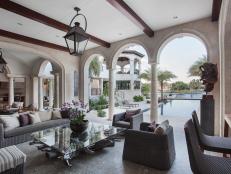 Mediterranean Outdoor Space with Arches, Wood Beams and Stone Floors