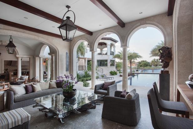 Mediterranean Outdoor Space with Arches, Wood Beams and Stone Floors