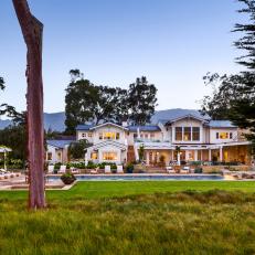 Gorgeous White, Contemporary Home Exterior With Spacious Back Yard Pool Area and Lawn