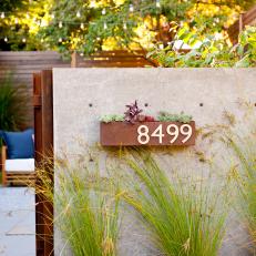 Modern Seattle Courtyard with Metal Planter and Concrete Wall