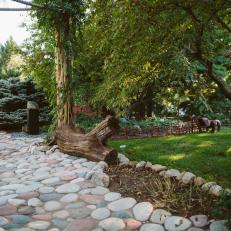 Multicolored Round River Stone Walkway Encourages Reflection in Asian Garden