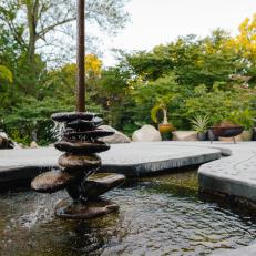 Round River Stones in Patio Fountain Encourage Interaction