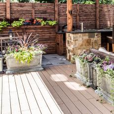 Container Plantings Add Color to Rustic Deck