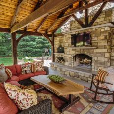 Cozy Up by the Outdoor Fireplace and Watch TV