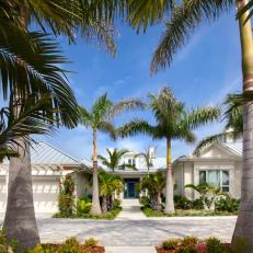 Tropical Entryway with Palm Trees and Driveway