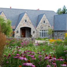 Old World-style Garden Design and Architecture with Stone Exterior and Perennials