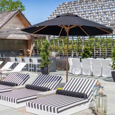 Sleek, Modern Poolside Lounge Chairs With Striped Cushions