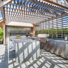 Trellis-Covered Outdoor Kitchen With Stainless Steel Cabinets