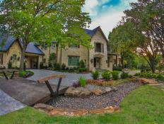 Two Story Stone Home with Dry Creek Bed and Garden