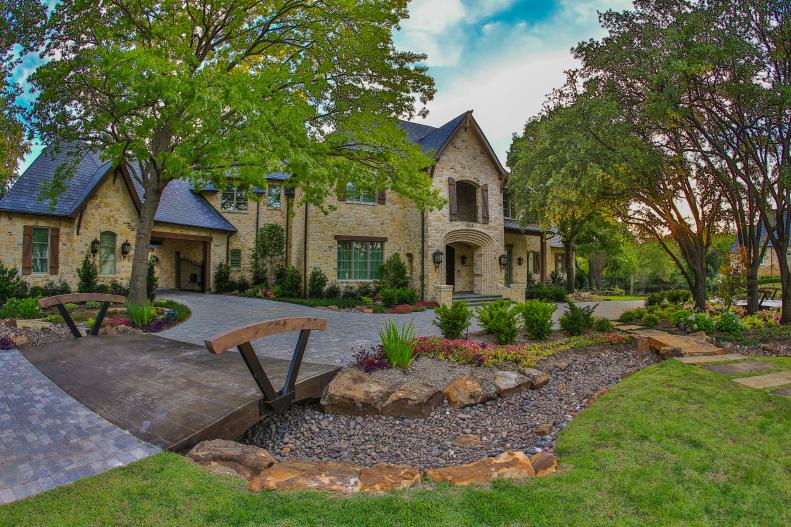 Two Story Stone Home with Dry Creek Bed and Garden