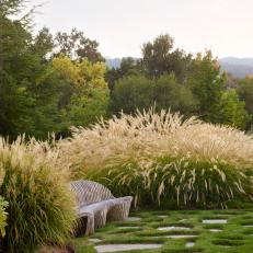 Pastoral Garden with Teak Bench, Stone Pavers and Flowering Grasses