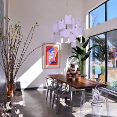 White Eclectic Dining Room With Concrete Floor